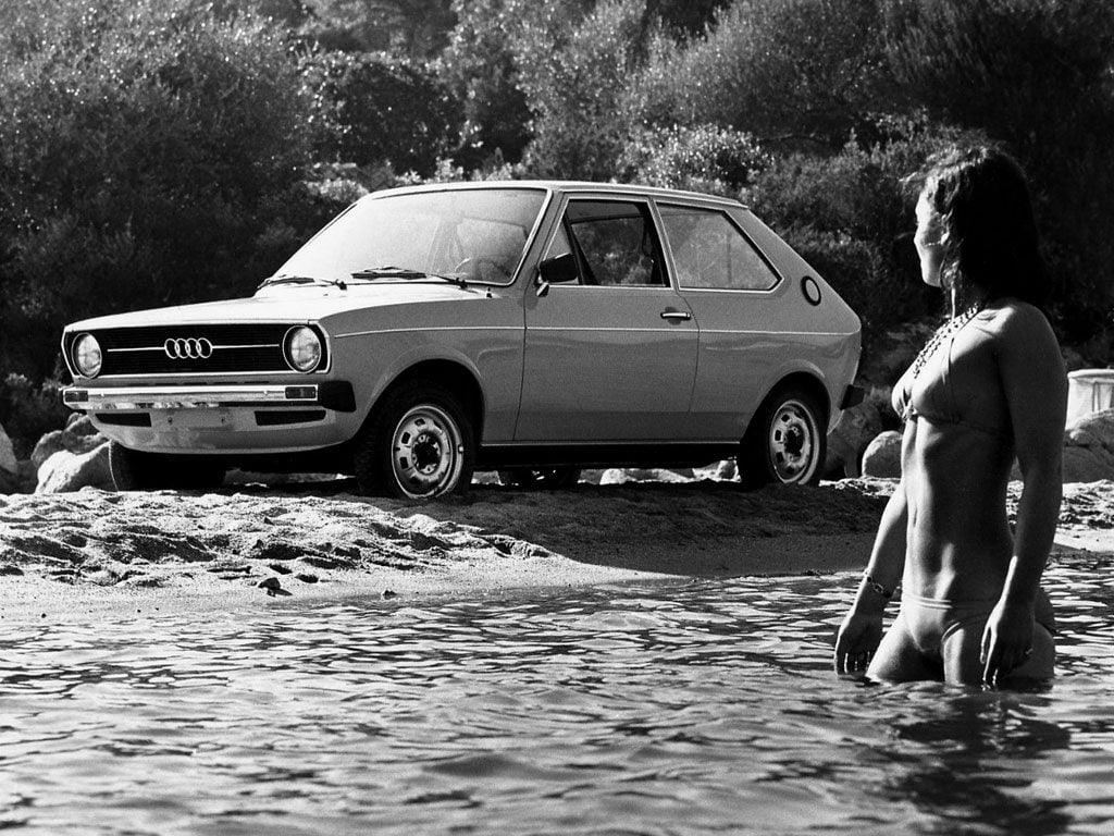 Audi 50 GL and lady in water