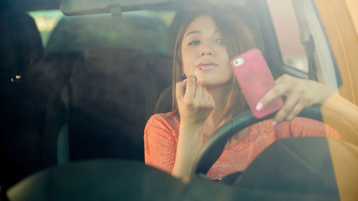 Girl using phone while driving